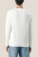 Rundhalset genser i kashmirblanding med brodert flagglogo